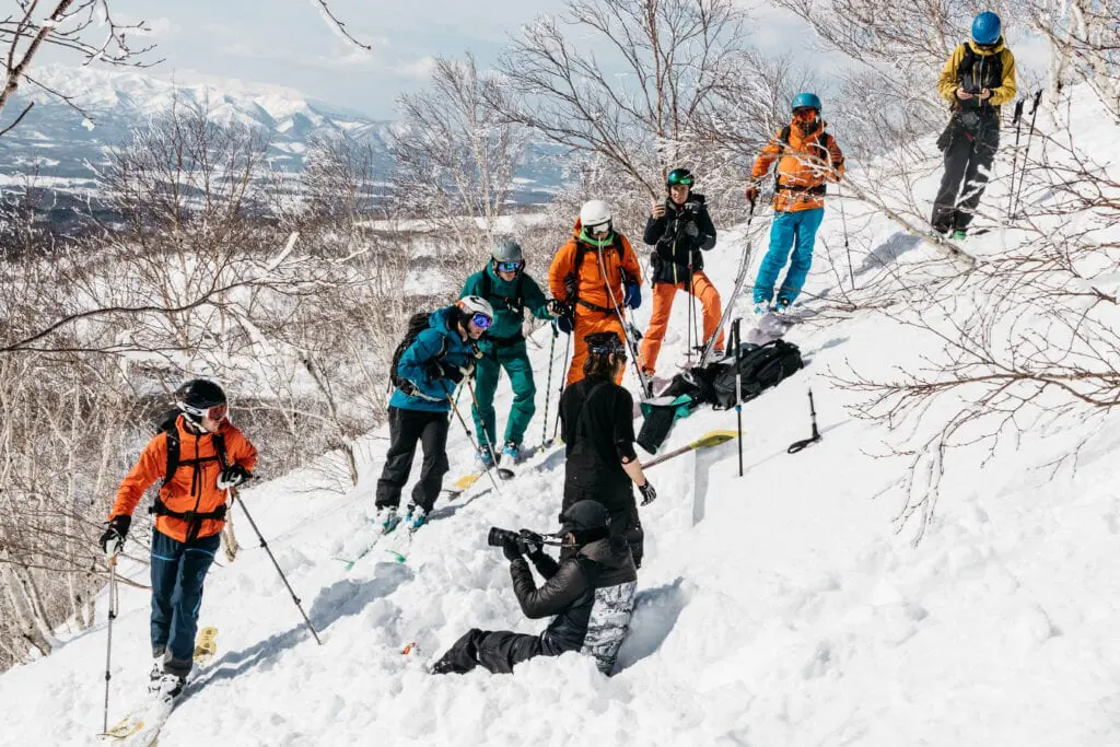 Group of Skiers in Japan doing the Four Volcanoes Challenge and following Avalanche Safety tips